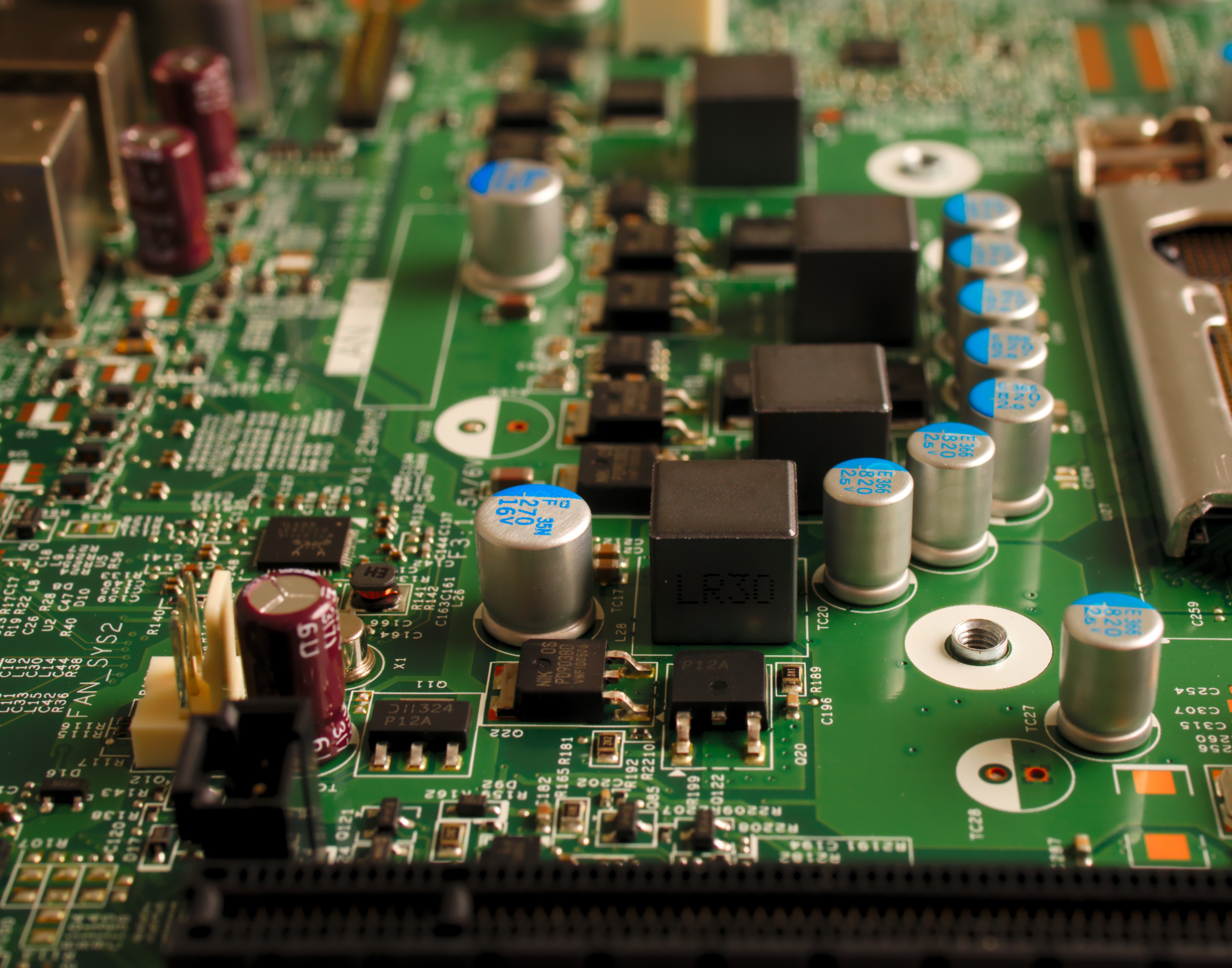 Figure 1. Capacitors on a modern electronic board. If you look closely, you’ll notice that different kinds of capacitors are used in different subcircuits for different roles. Picture by Michael Dziedzic